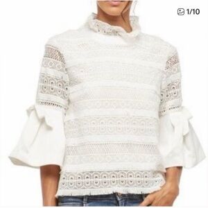 White Lace Mock-Neck Bell Sleeve Top with bows in sleeves
